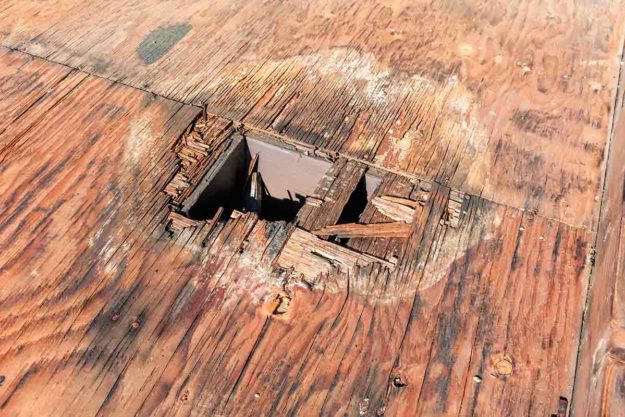 a hole in a roof which is one of the Signs of roof rot
