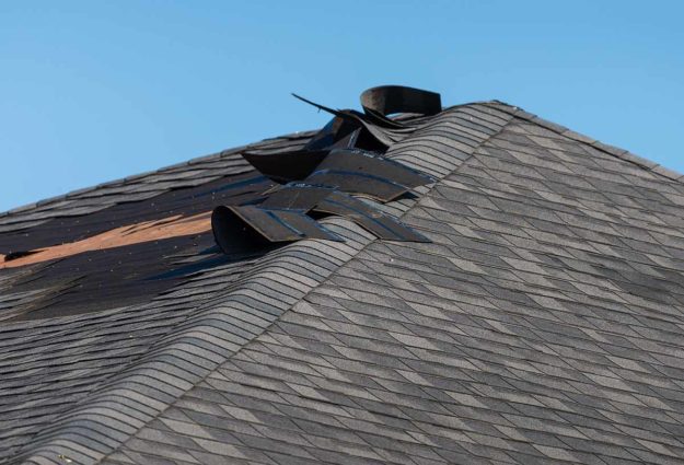 a home with a wind damaged roof