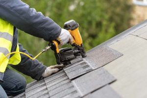 man installs a roof in rockville maryland 
