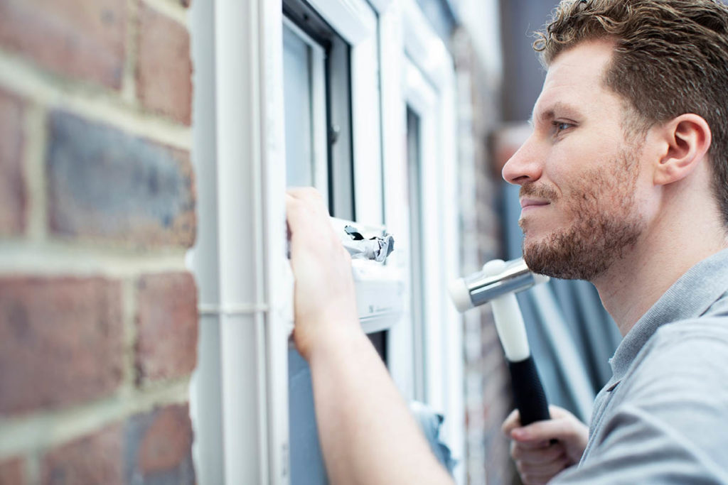 person showing how to repair cracked vinyl windows