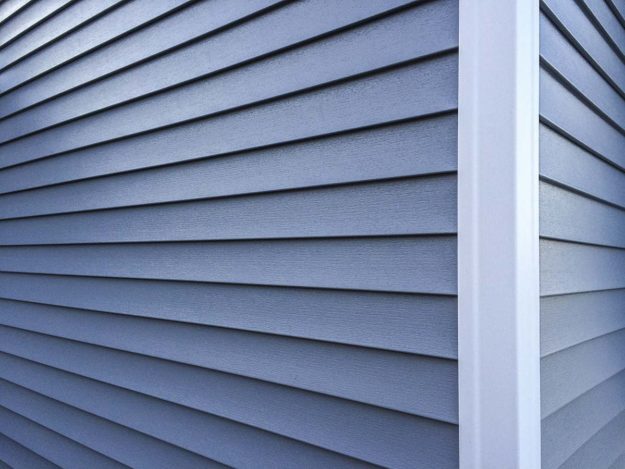the corner of a house with fiber cement siding