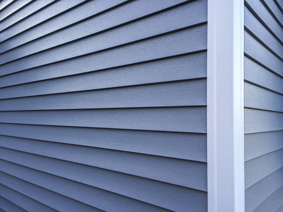 the corner of a house with fiber cement siding