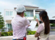 Homeowner discussing roofing options with contractor