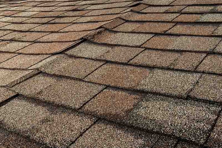 Closeup of a worn down shingle roof